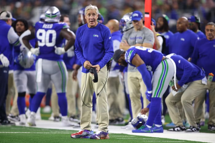 Seattle Seahawks head coach Pete Carroll (left) looks on during the first half against the Dallas Cowboys at AT&T Stadium.